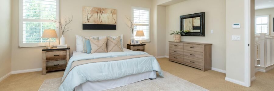 Bright modern bedroom with neutral decor and cozy ambiance, perfect for home decor inspiration.