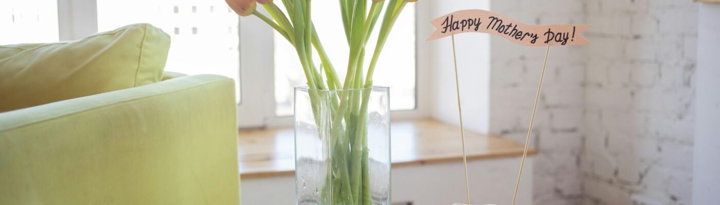 Bright and cozy Mother's Day setup with pancakes and tulips indoors.